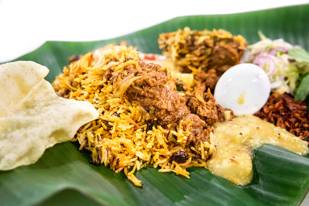 Close-up on nasi briyani with lambserved on banana leaf